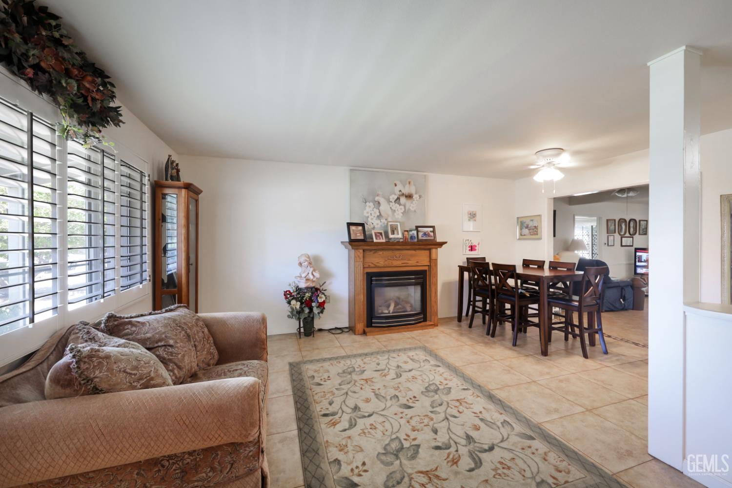 Undisclosed Address Bakersfield, CA 93309 - Photo 6 of 22 a living room with furniture and a fireplace