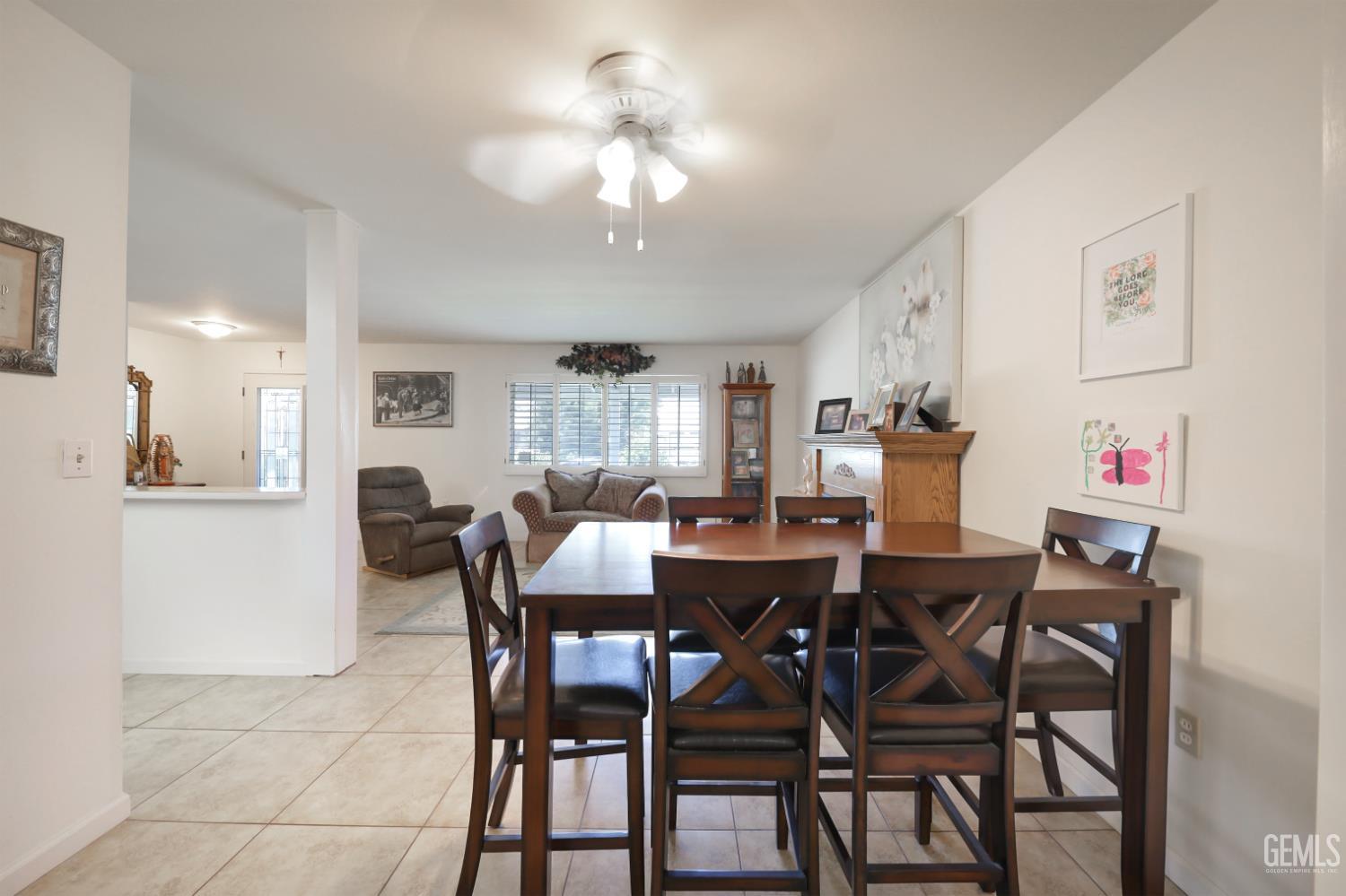 Undisclosed Address Bakersfield, CA 93309 - Photo 7 of 22 a view of a dining room with furniture and chandelier