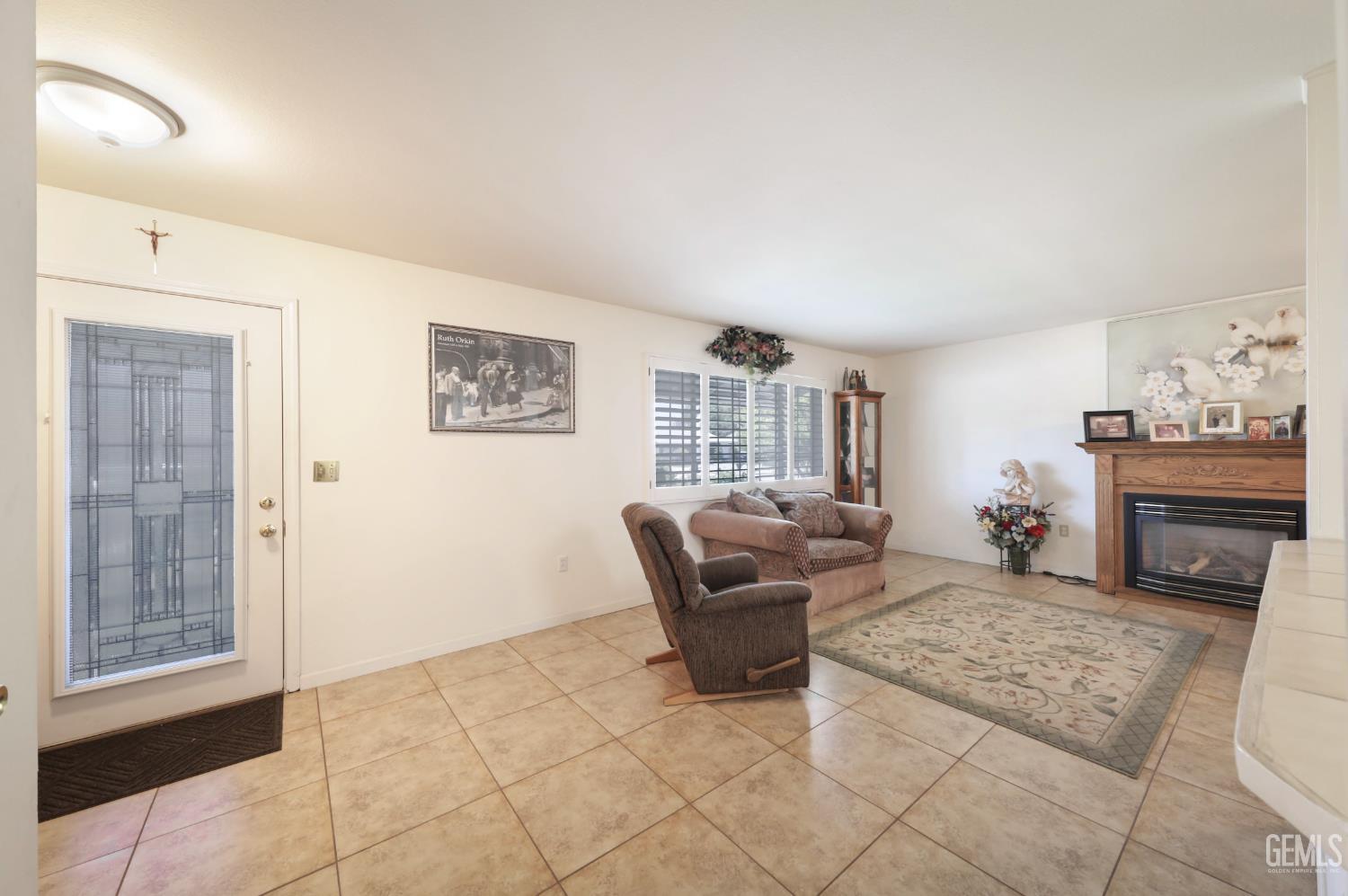 Undisclosed Address Bakersfield, CA 93309 - Photo 8 of 22 a living room with furniture and a fireplace