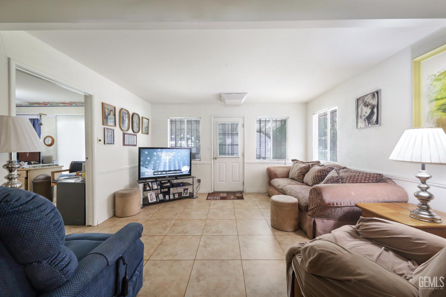 Undisclosed Address Bakersfield, CA 93309 - Photo 9 of 22 a living room with furniture and a couch