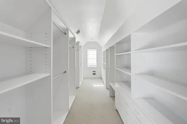 a view of a hallway with a white walls