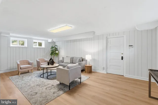 a living room with furniture and a rug
