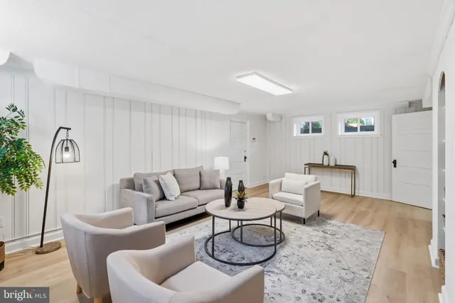 a living room with furniture and a rug