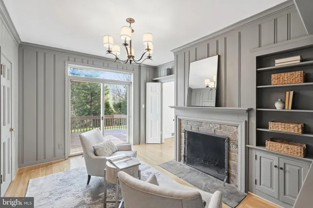 a living room with furniture a window and a fireplace