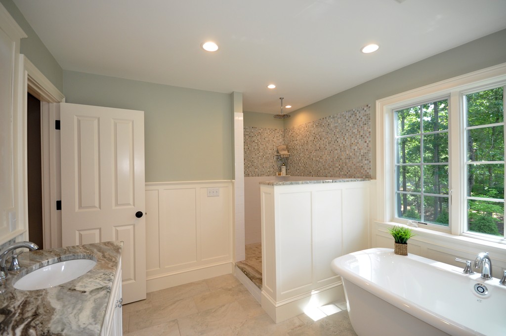 3 Irene Road Bedford, MA 01730 - Photo 16 of 26 a bathroom with a granite countertop sink and a mirror