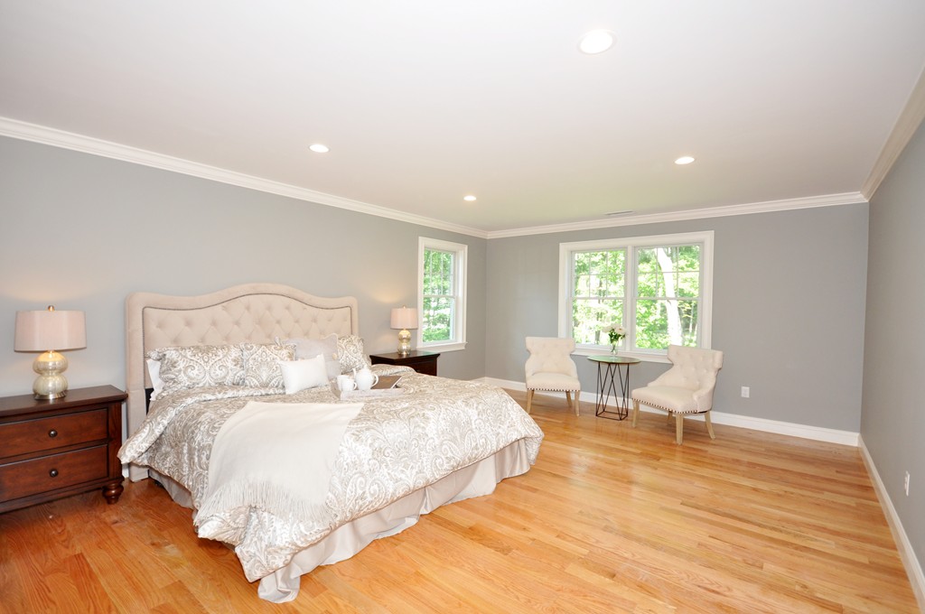 3 Irene Road Bedford, MA 01730 - Photo 18 of 26 a bed room with a bed and a chair