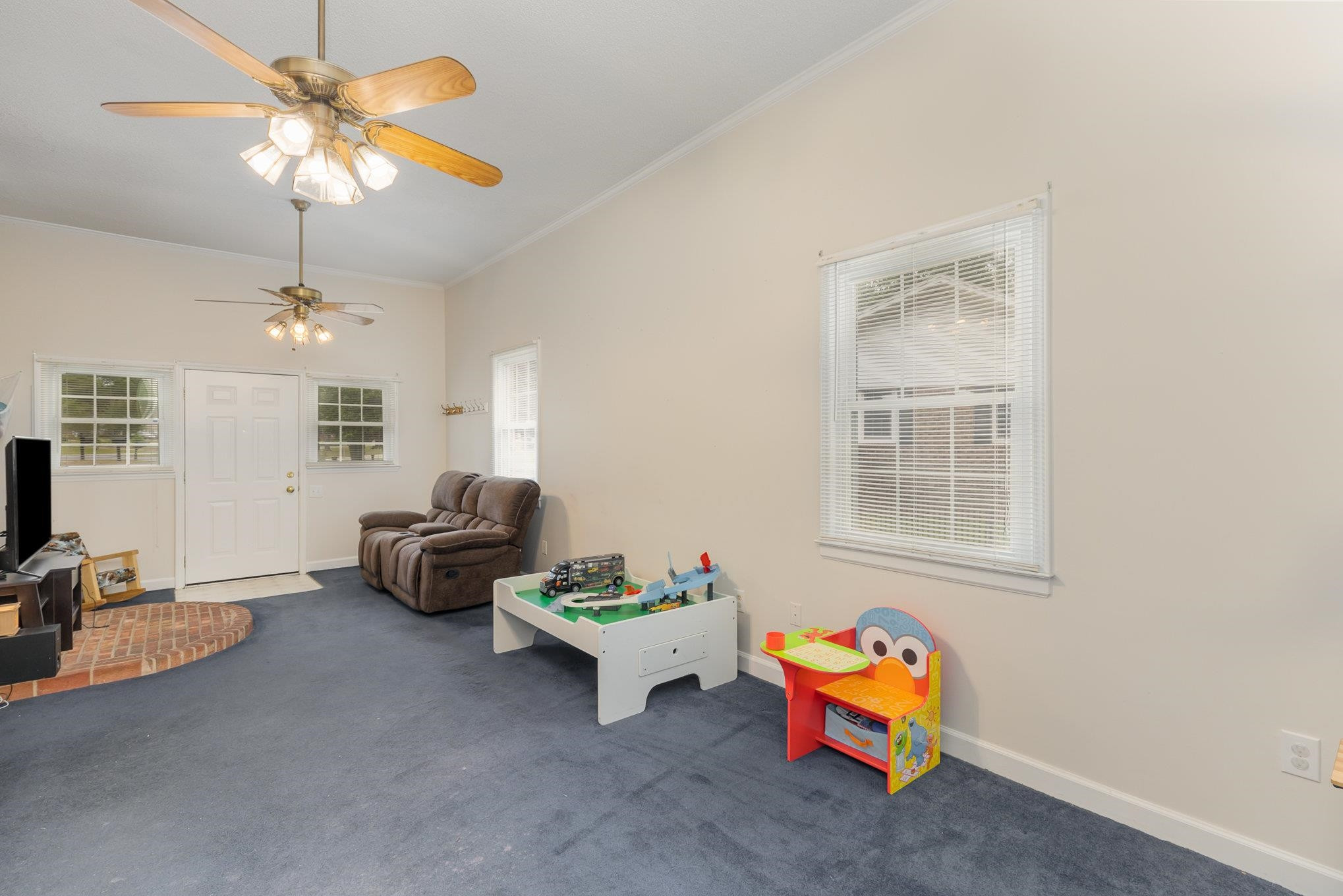 65 White Oak Drive Smithfield, NC 27577 - Photo 14 of 25 a living room with furniture and chandelier