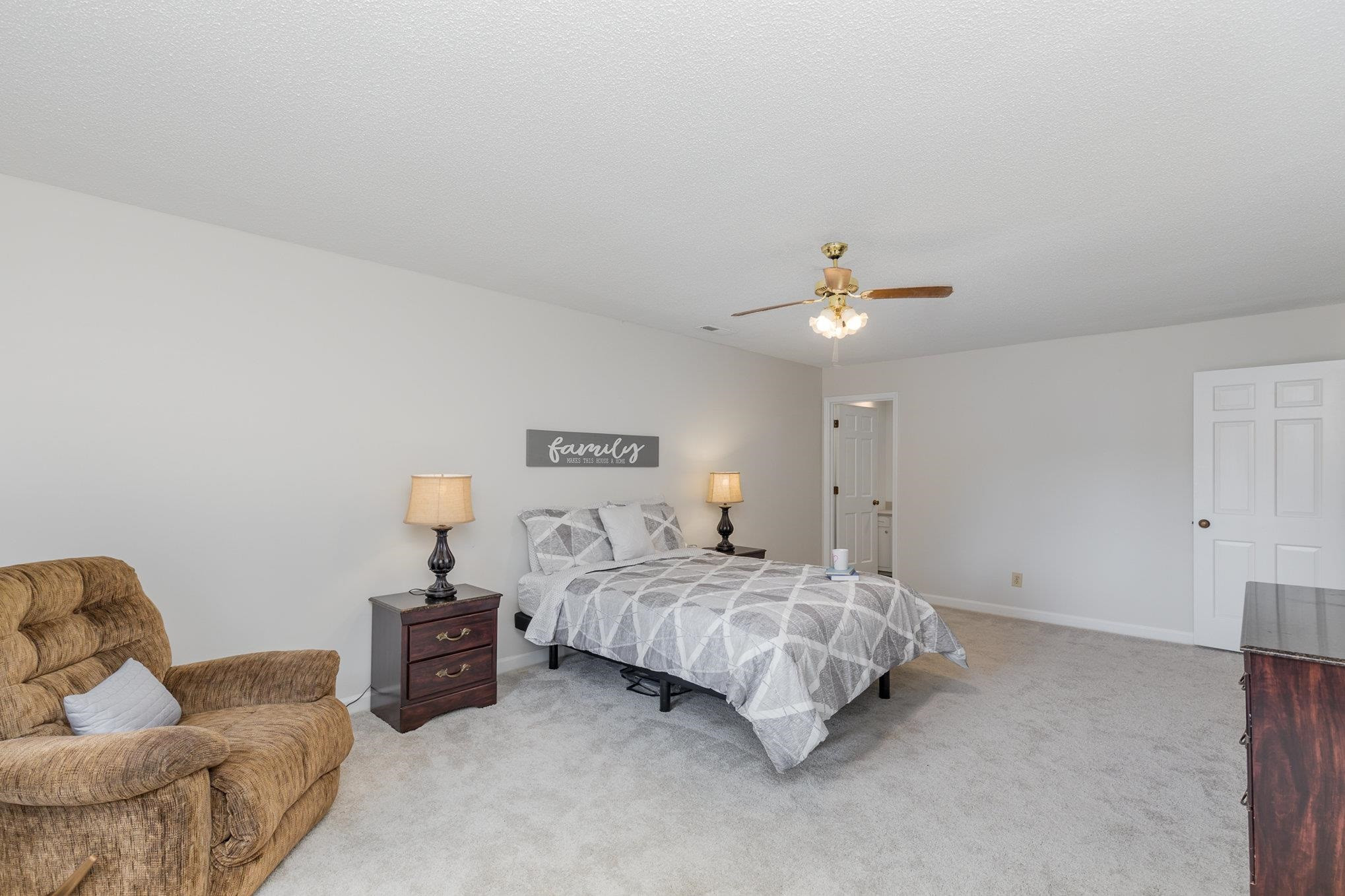 65 White Oak Drive Smithfield, NC 27577 - Photo 16 of 25 a bedroom with a bed and ceiling fan