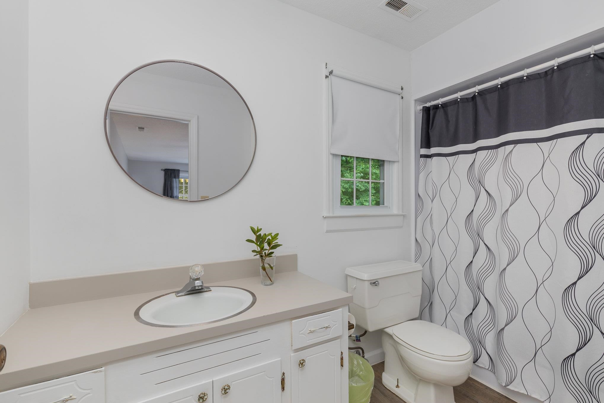 65 White Oak Drive Smithfield, NC 27577 - Photo 17 of 25 a bathroom with a granite countertop sink mirror and toilet
