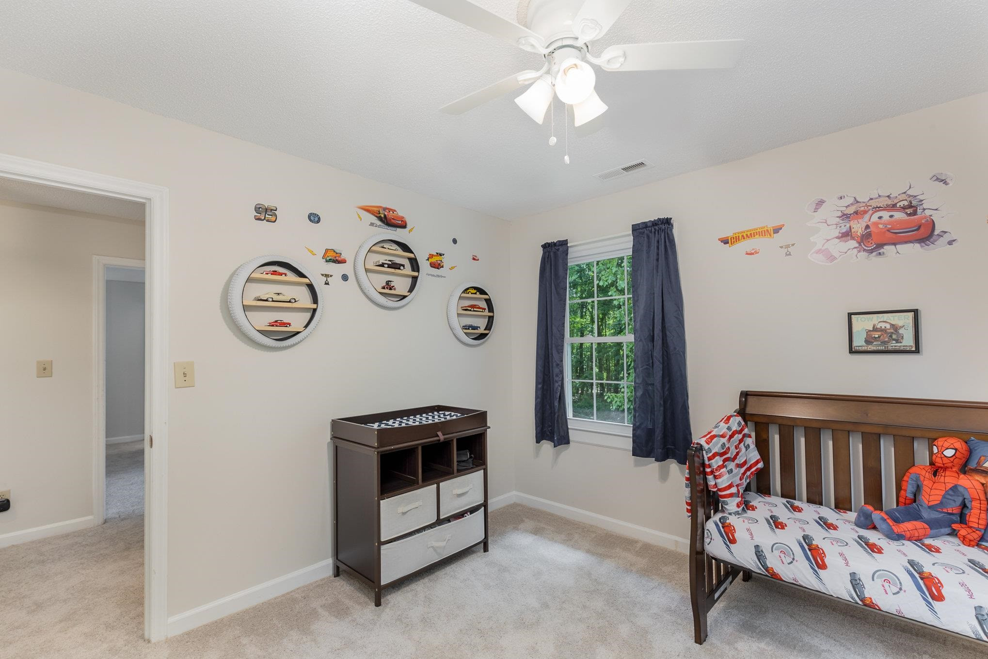 65 White Oak Drive Smithfield, NC 27577 - Photo 19 of 25 a bedroom with furniture and a large window