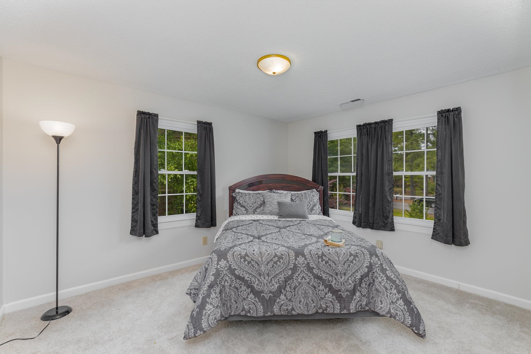 65 White Oak Drive Smithfield, NC 27577 - Photo 20 of 25 a bedroom with a large bed and a window