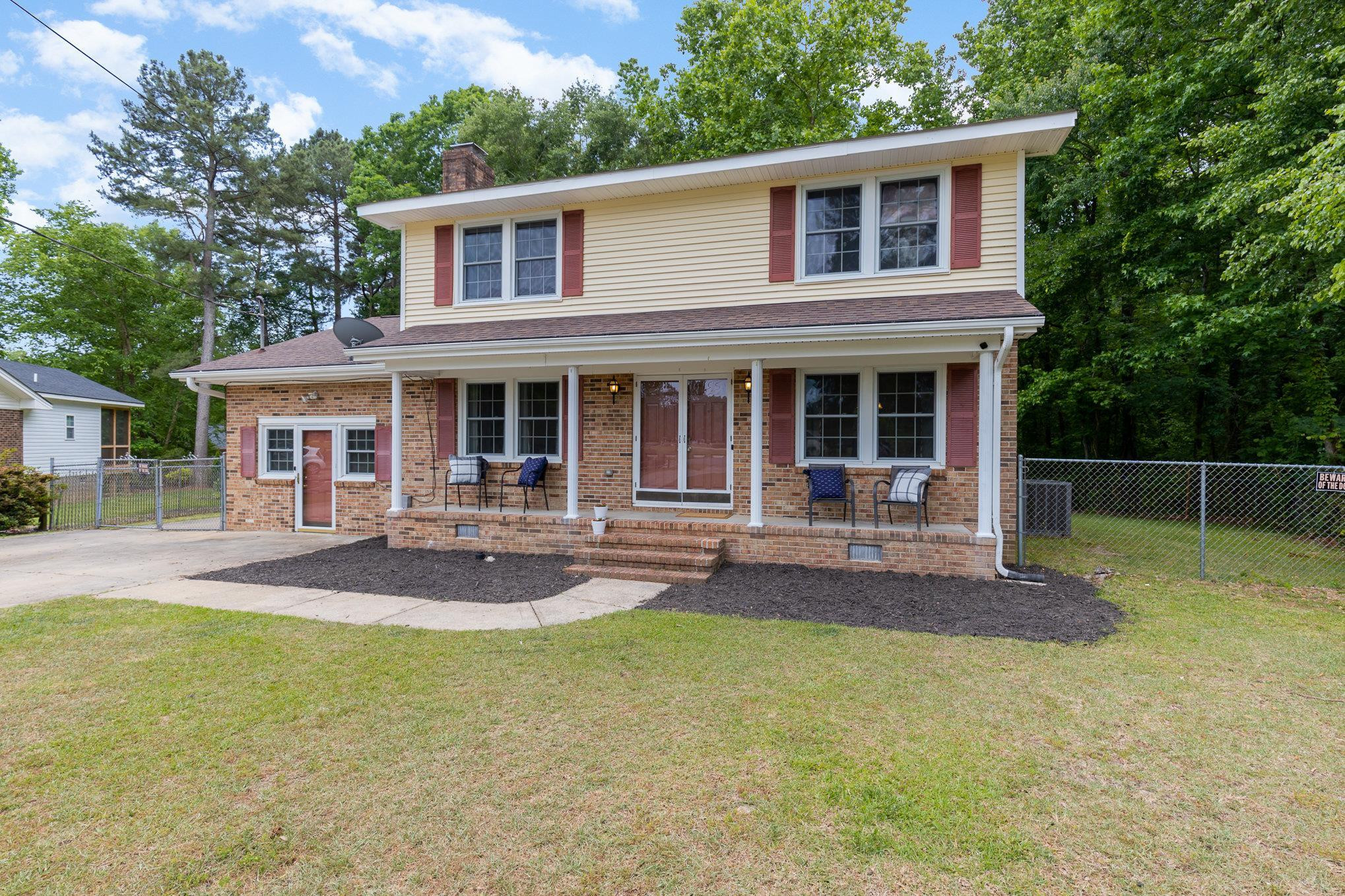 65 White Oak Drive Smithfield, NC 27577 - Photo 2 of 25 a front view of a house with a yard