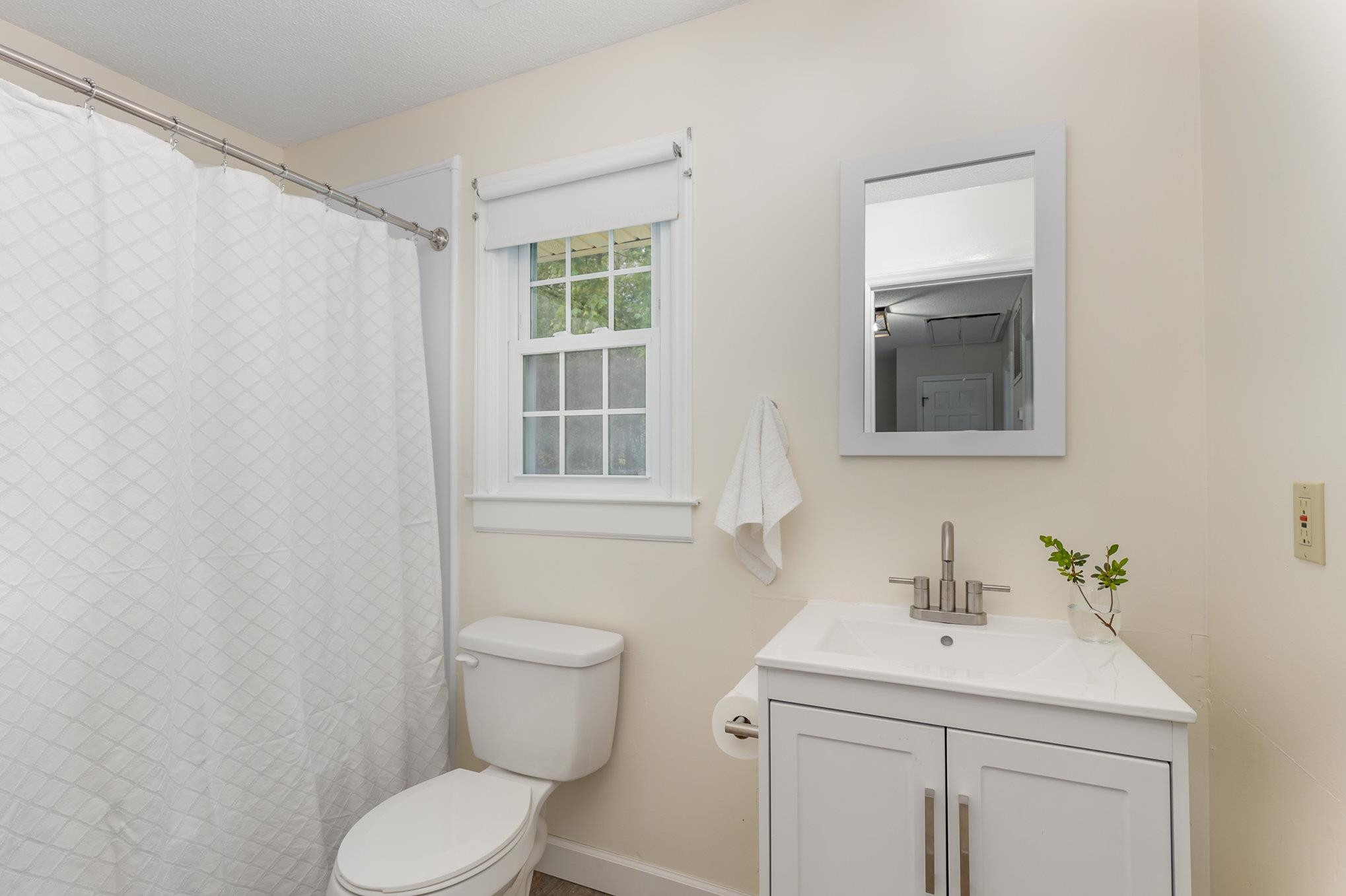 65 White Oak Drive Smithfield, NC 27577 - Photo 21 of 25 a bathroom with a sink toilet and vanity