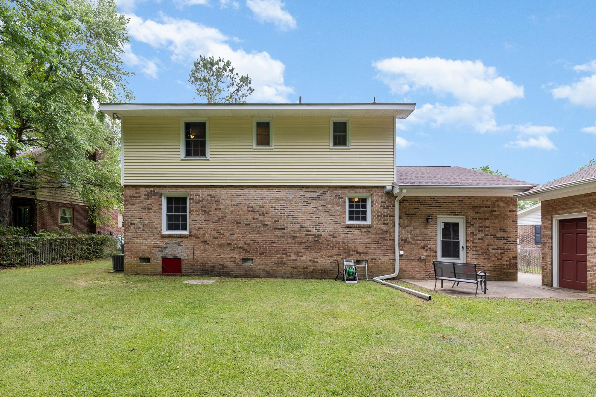 65 White Oak Drive Smithfield, NC 27577 - Photo 22 of 25 a view of a house with a patio and a yard