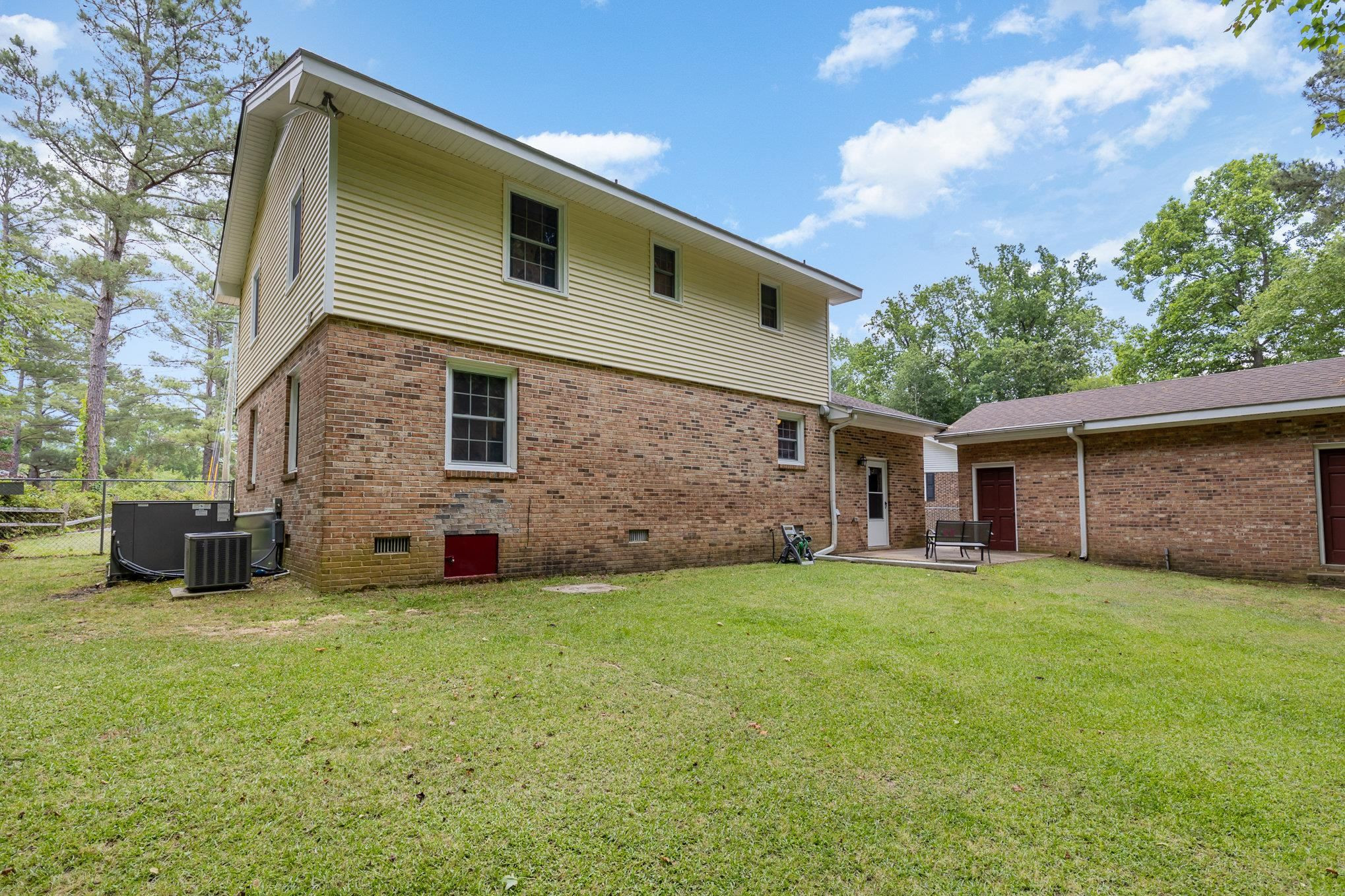 65 White Oak Drive Smithfield, NC 27577 - Photo 23 of 25 a view of a house with a yard and a garden