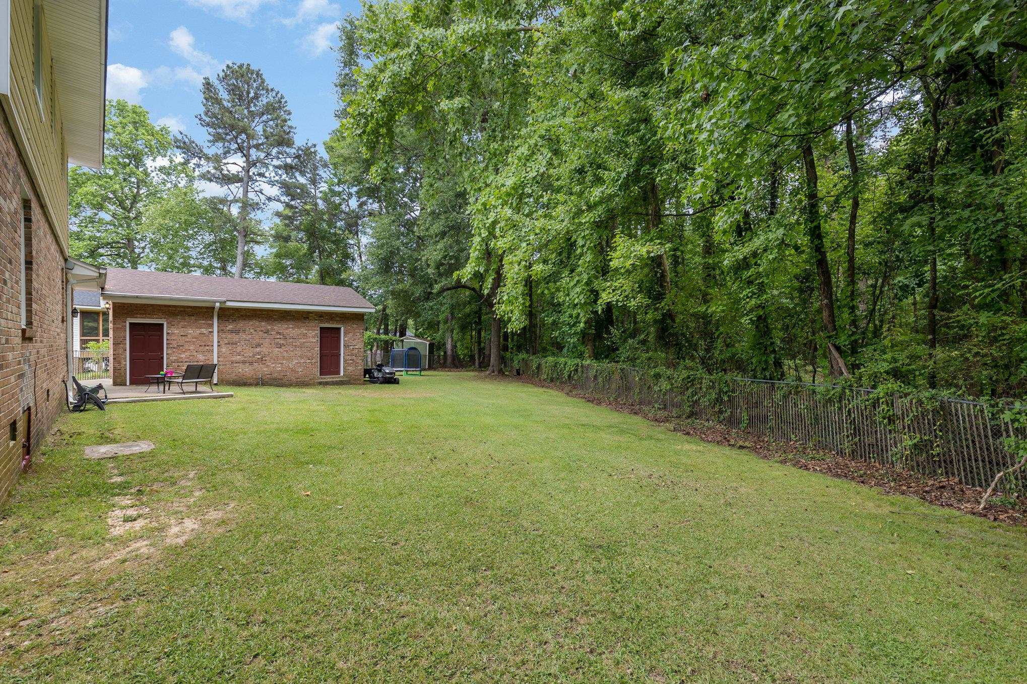 65 White Oak Drive Smithfield, NC 27577 - Photo 24 of 25 a front view of a house with a garden and yard