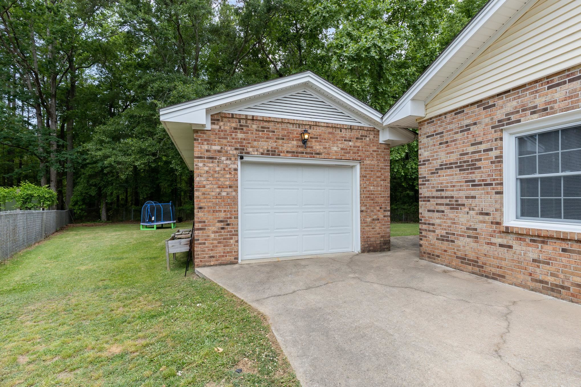 65 White Oak Drive Smithfield, NC 27577 - Photo 3 of 25 a front view of a house with a yard and garage