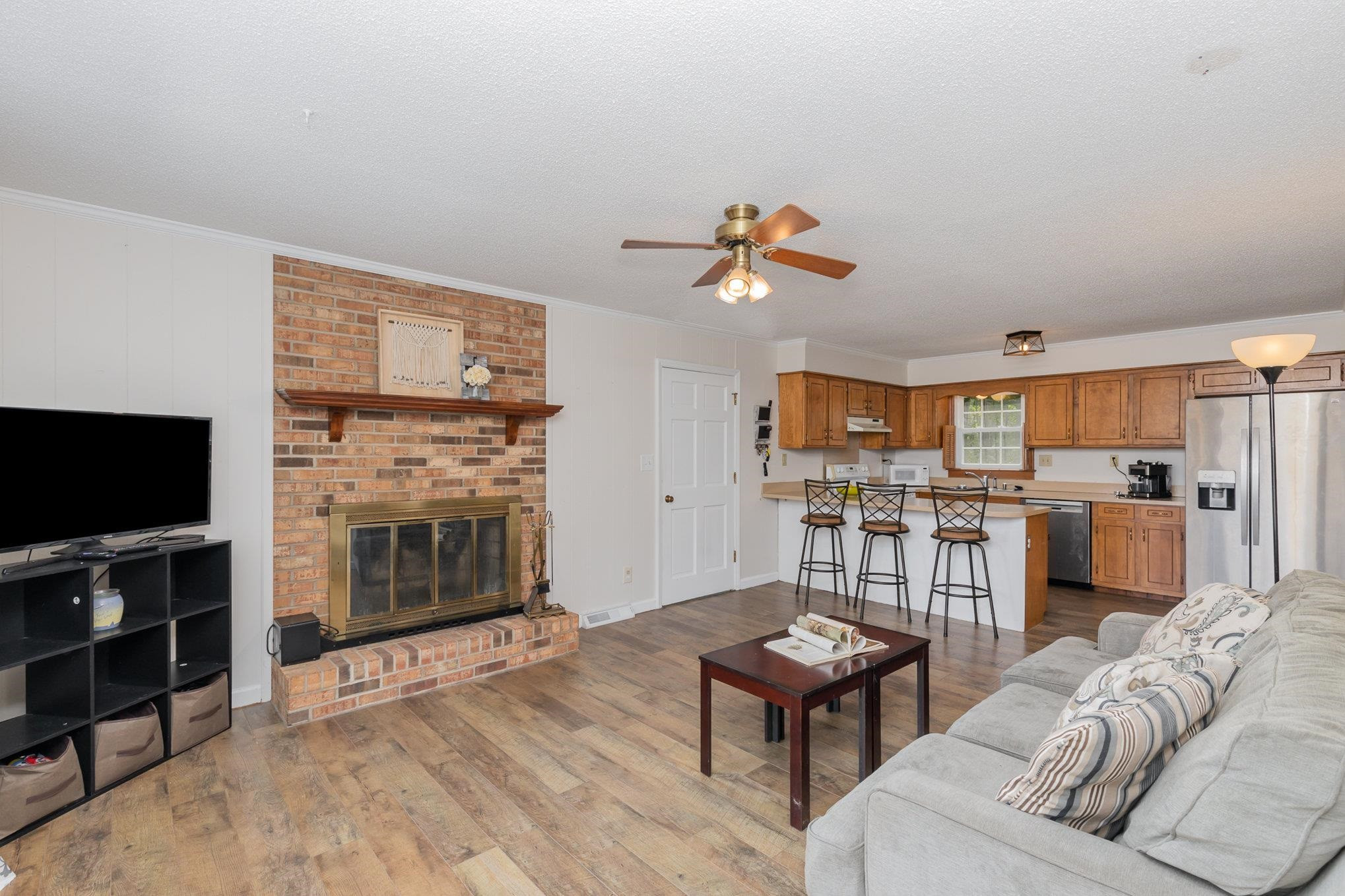 65 White Oak Drive Smithfield, NC 27577 - Photo 4 of 25 a living room with furniture and a flat screen tv