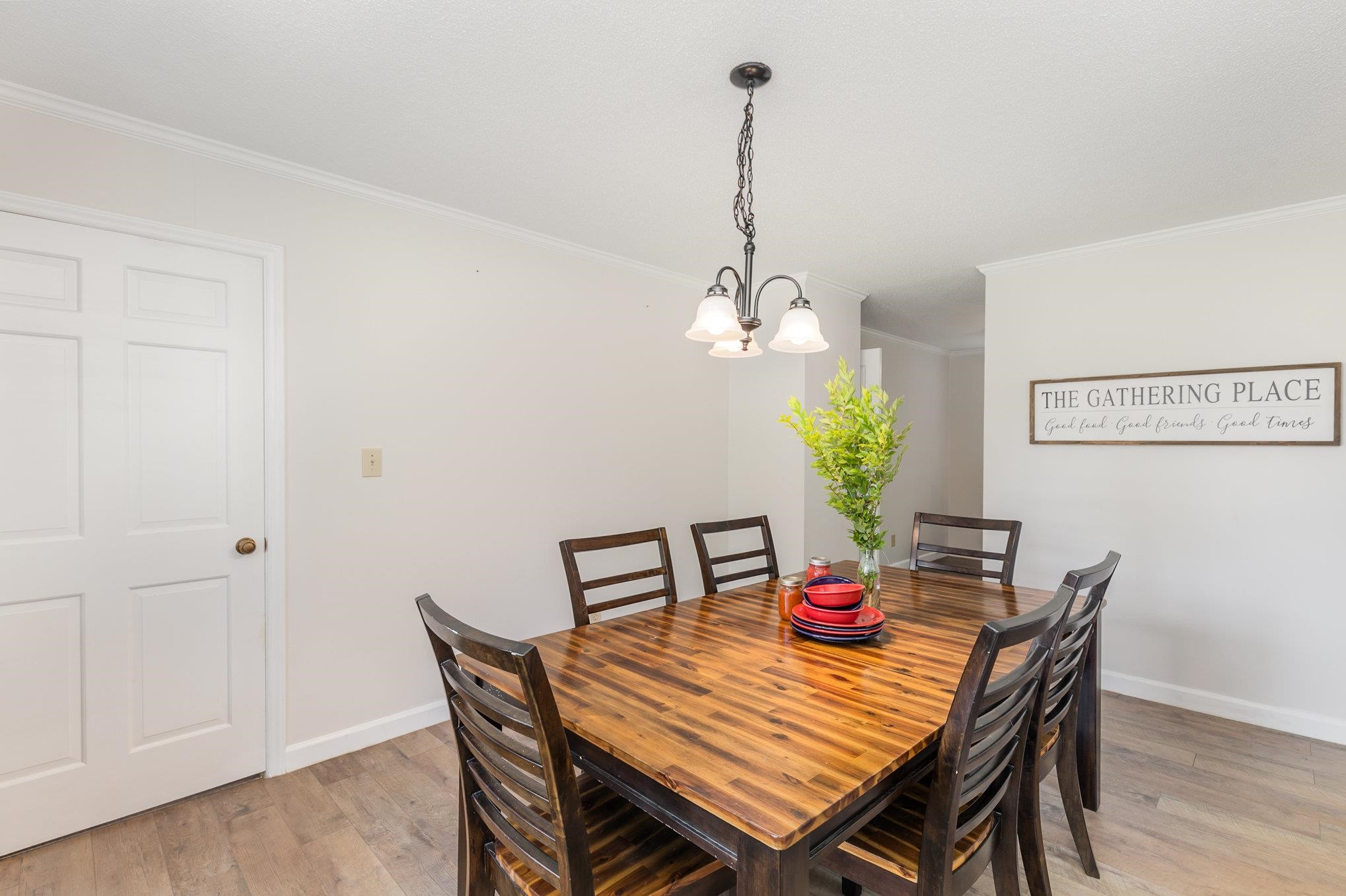 65 White Oak Drive Smithfield, NC 27577 - Photo 7 of 25 a view of a dining room with furniture wooden floor and chandelier