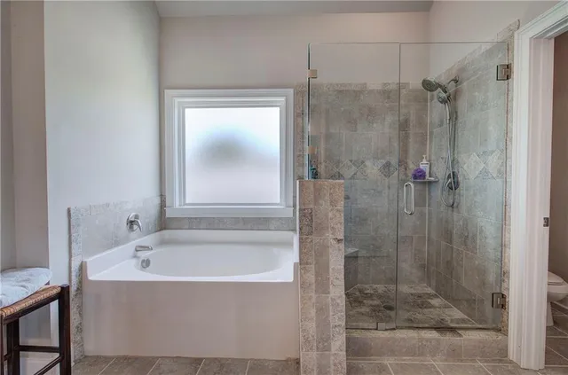 a view of a hallway with wooden floor and stairs