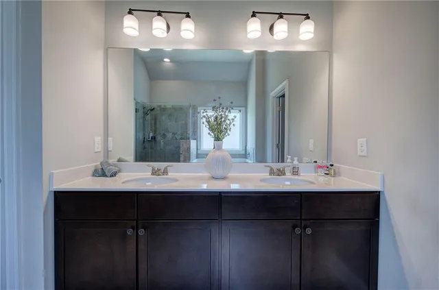 a spacious bedroom with a bed and window