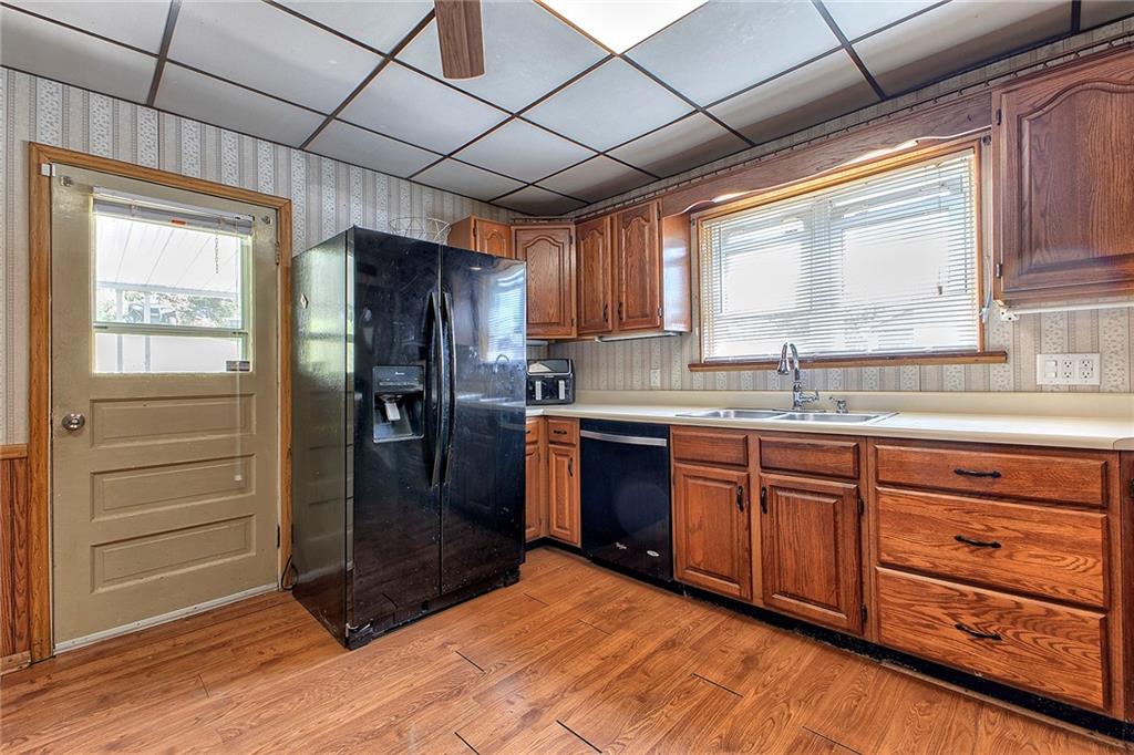 8005 Hayward Street Irwin, PA 15642 - Photo 6 of 22 a kitchen with granite countertop wooden cabinets and a stainless steel appliances