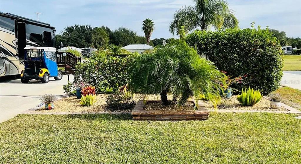 9531 Southeast 47th Way, Unit 280 Webster, FL 33597 - Photo 2 of 27 a view of outdoor space yard and green space