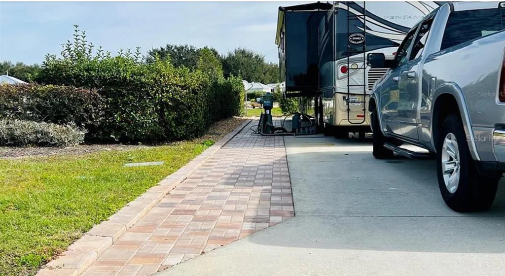 9531 Southeast 47th Way, Unit 280 Webster, FL 33597 - Photo 3 of 27 a view of yard with seating space