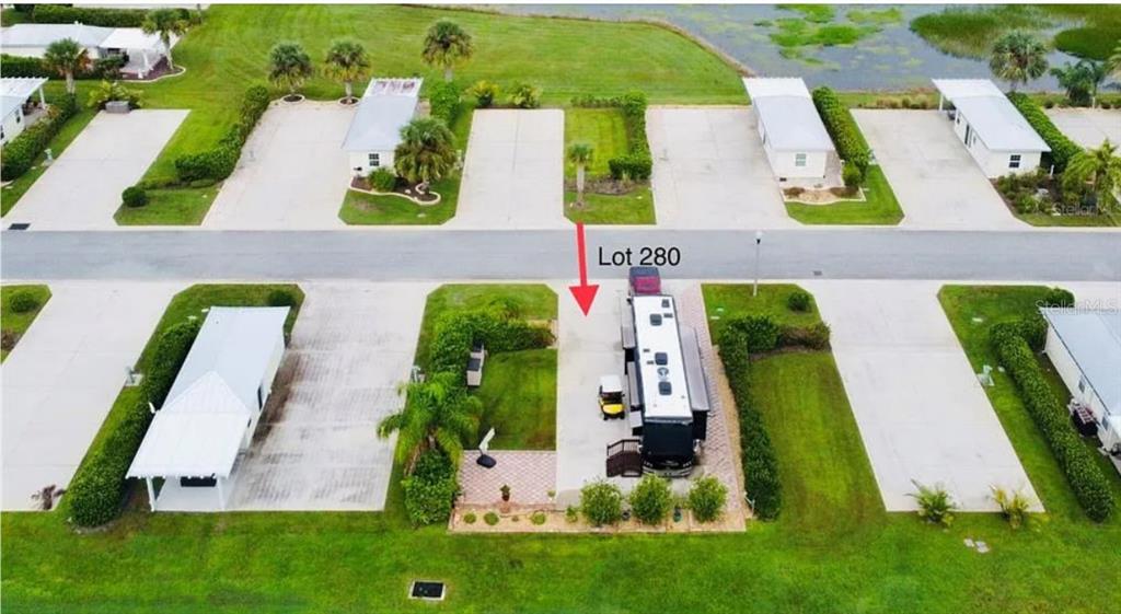 9531 Southeast 47th Way, Unit 280 Webster, FL 33597 - Photo 4 of 27 an aerial view of a house