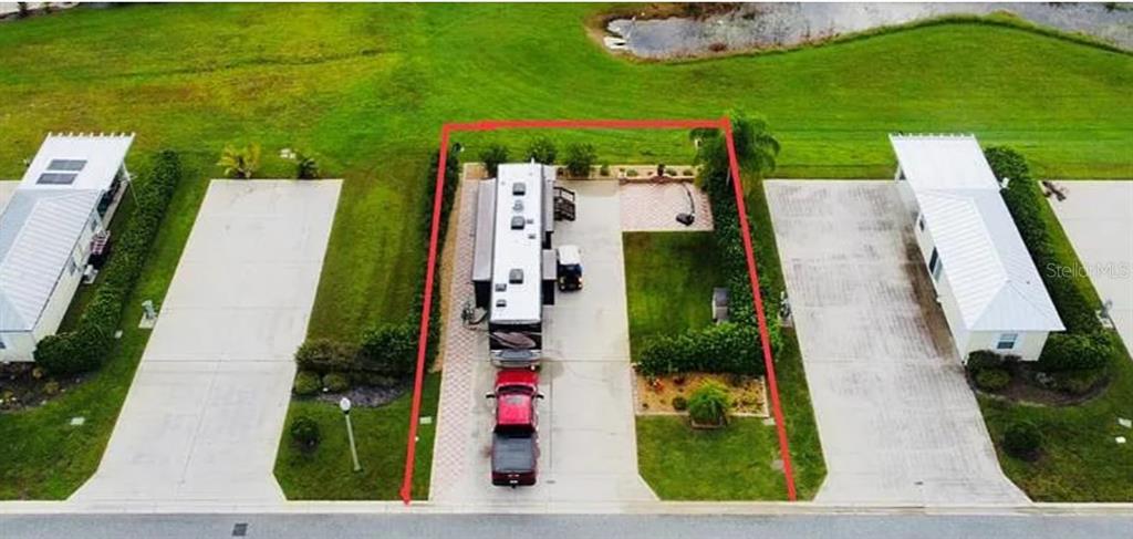 9531 Southeast 47th Way, Unit 280 Webster, FL 33597 - Photo 5 of 27 an aerial view of a house