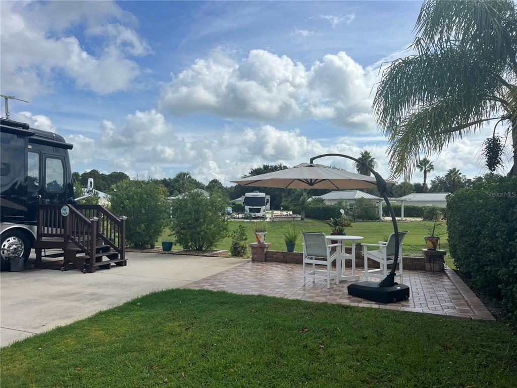9531 Southeast 47th Way, Unit 280 Webster, FL 33597 - Photo 6 of 27 a view of a car park in front of house