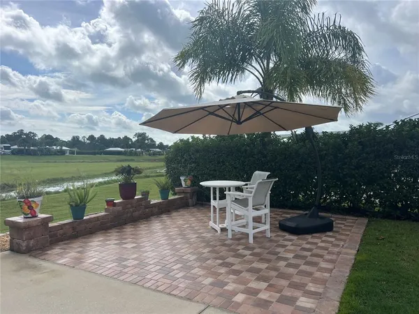 a view of a patio with chair and table on the patio