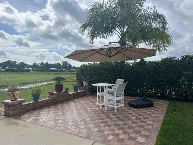 a view of a patio with chair and table on the patio