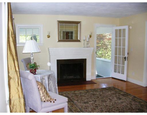 46 Gleason Road Lexington, MA 02420 - Photo 3 of 5 a living room with furniture and a fireplace