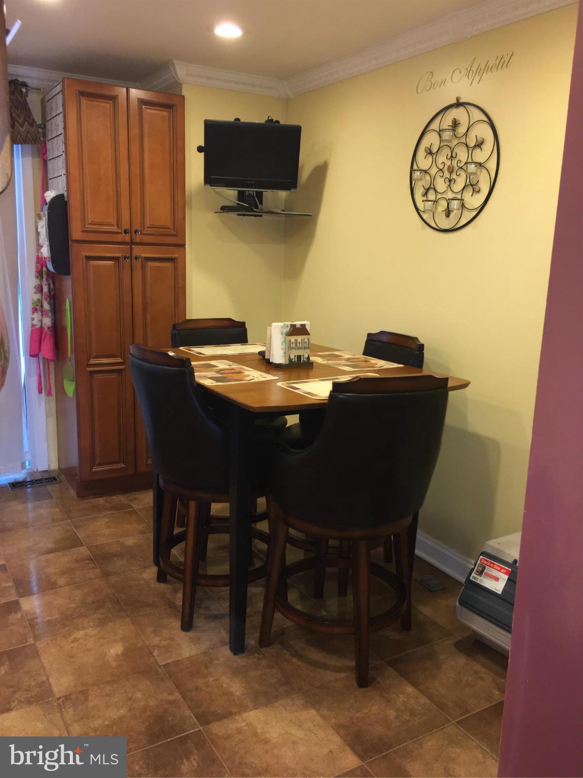 2232 Riding Crop Way Baltimore, MD 21244 - Photo 5 of 12 a view of a dining room with furniture
