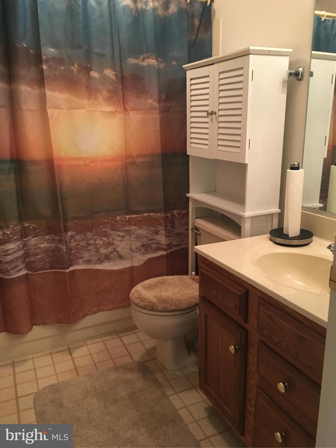2232 Riding Crop Way Baltimore, MD 21244 - Photo 10 of 12 a bathroom with a granite countertop sink toilet and shower