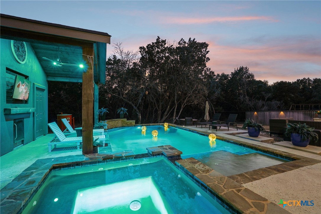 a view of a backyard with swimming pool