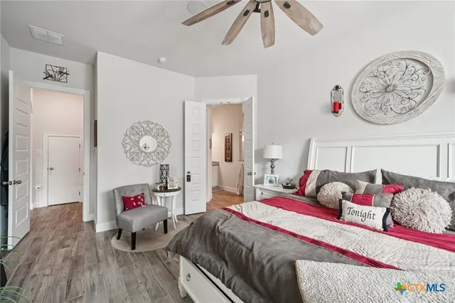 a bedroom with a bed and window