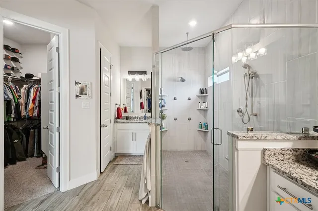 a bedroom with two beds and a couch