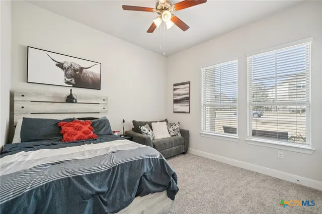 a bathroom with a toilet a sink and shower