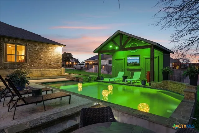 a view of swimming pool from a sitting area