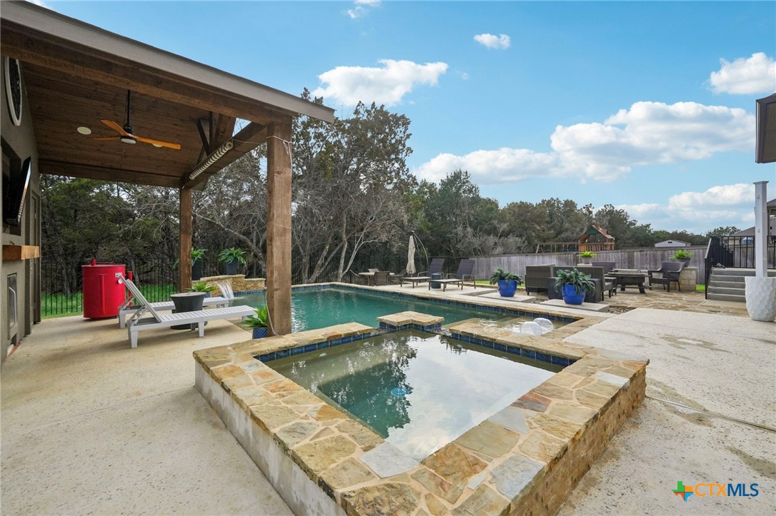 424 Heidelberg Road New Braunfels, TX 78132 - Photo 37 of 41 a view of swimming pool with a patio and a yard