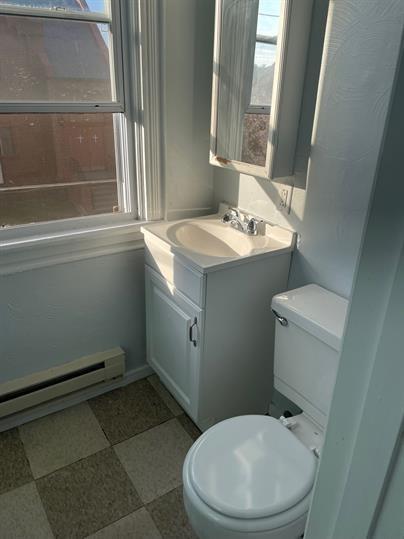 5220 Holmes Street Pittsburgh, PA 15201 - Photo 11 of 18 a bathroom with a sink toilet and window