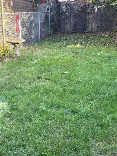 5220 Holmes Street Pittsburgh, PA 15201 - Photo 18 of 18 a view of a backyard with a tree