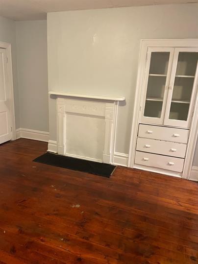 5220 Holmes Street Pittsburgh, PA 15201 - Photo 2 of 18 a view of an empty room with wooden floor and a window