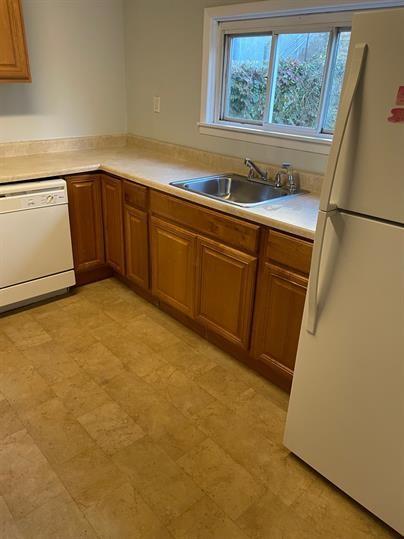 5220 Holmes Street Pittsburgh, PA 15201 - Photo 5 of 18 a kitchen with a sink and cabinets