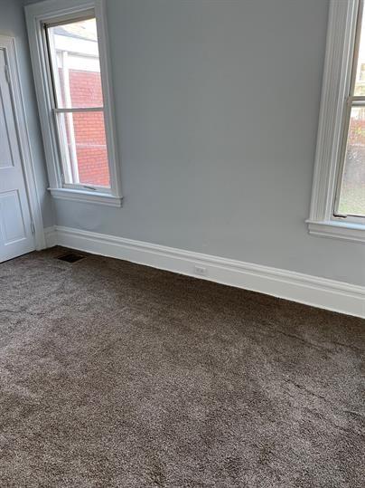 5220 Holmes Street Pittsburgh, PA 15201 - Photo 7 of 18 an empty room with a window