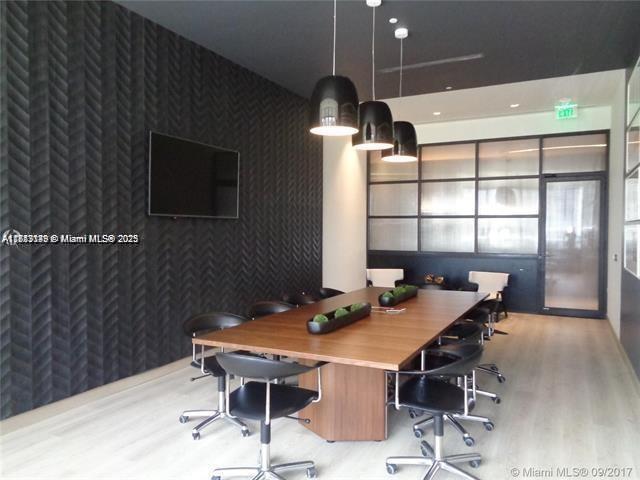 45 Southwest 9th Street, Unit 2709 Miami, FL 33130 - Photo 26 of 34 a view of a dining room with furniture