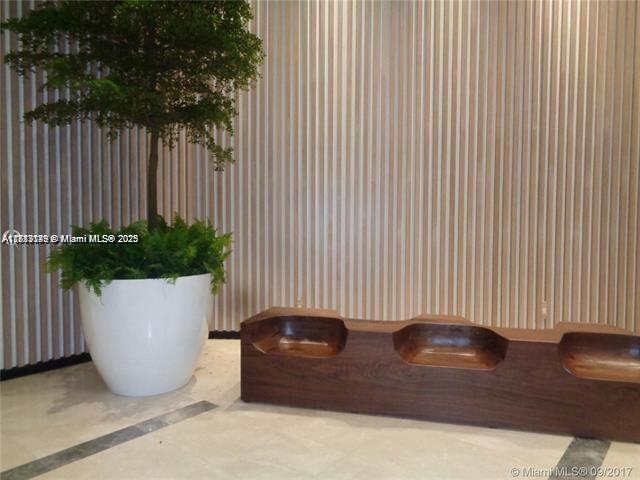 45 Southwest 9th Street, Unit 2709 Miami, FL 33130 - Photo 33 of 34 a view of a potted plant and in front of a house