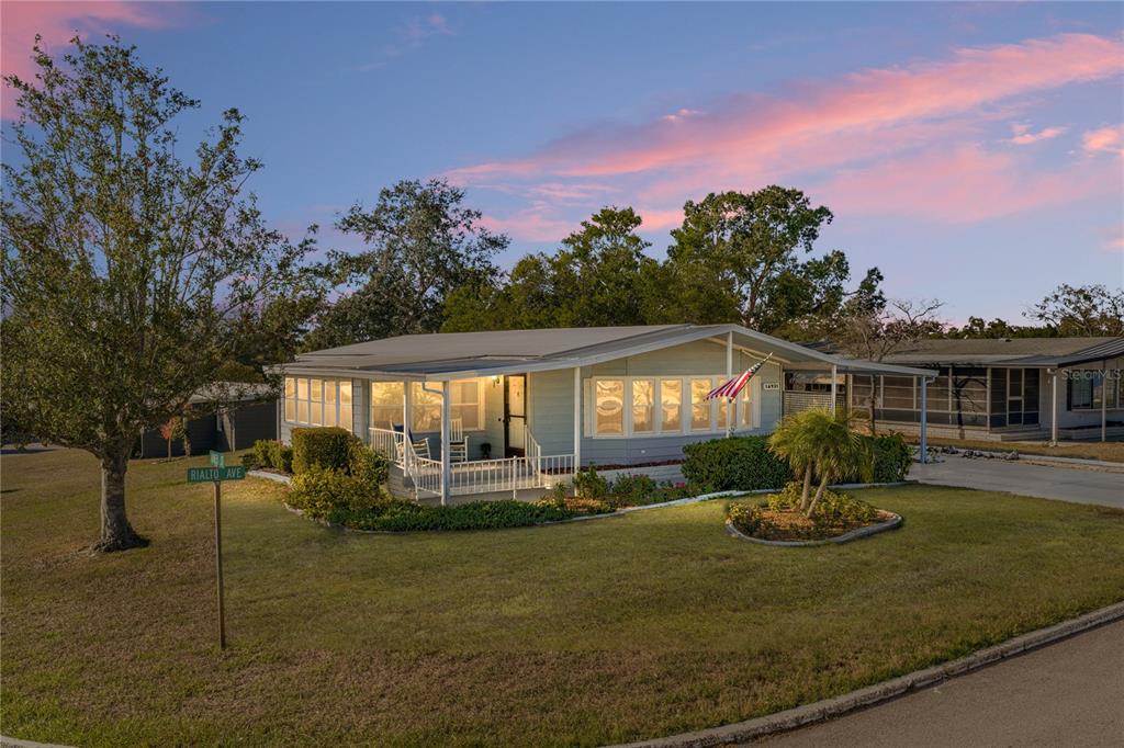 a front view of a house with a yard fountain